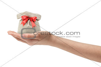 female teen hand holding sack back with present