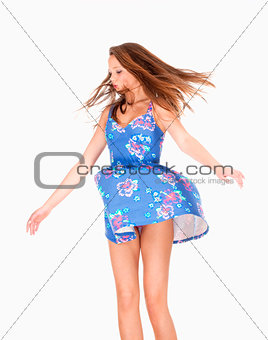 Teenage Girl in Summer Dress with Wind Lifting her Skirt 