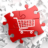 Shopping Cart Icon on Red Puzzle.