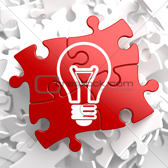 Light Bulb Icon on Red Puzzle.