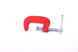 Red clamp on a white background
