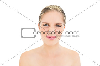 Funny fresh blonde woman wrinkling her nose