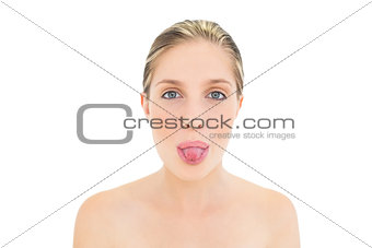 Charming fresh blonde woman posing with tongue out