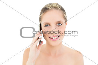 Delighted fresh blonde woman calling with her mobile phone