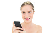 Content fresh blonde woman using her mobile phone