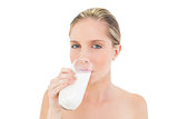 Dreamy fresh blonde woman drinking milk