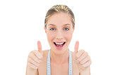 Delighted fresh blonde woman giving thumbs up