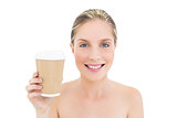 Happy fresh blonde woman holding a coffee cup