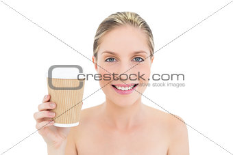 Happy fresh blonde woman holding a coffee cup