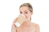 Playful fresh blonde woman drinking coffee