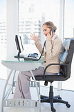 Angry blonde businesswoman on the phone