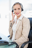 Peaceful blonde call centre agent posing