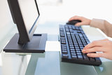Close up on businesswoman typing on keyboard