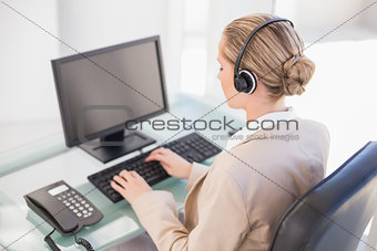Blonde call centre agent working