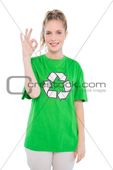 Happy blonde activist wearing recycling tshirt making okay gesture