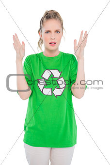 Annoyed blonde activist wearing recycling tshirt posing