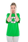 Anxious blonde activist wearing recycling tshirt posing