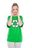Frowning blonde activist wearing recycling tshirt posing