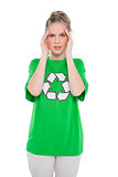 Frowning environmental activist wearing recycling tshirt posing