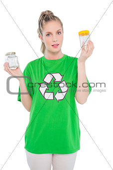Peaceful environmental activist wearing recycling tshirt holding jars