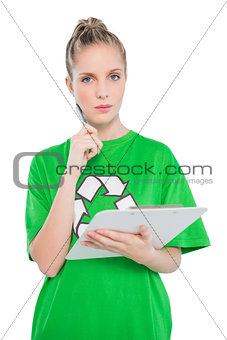 Pensive blonde activist holding clipboard
