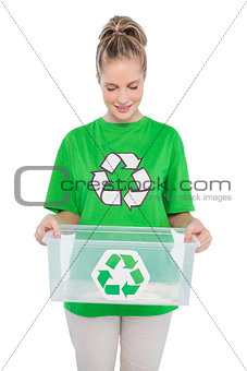 Smiling environmental activist holding recycling box