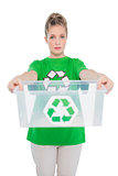 Shy environmental activist holding empty recycling box
