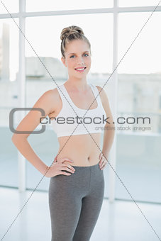Smiling sporty blonde posing
