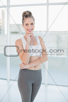 Cheerful sporty blonde posing