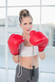 Sporty blonde wearing red boxing gloves