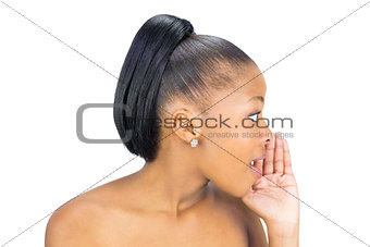 Side view of black woman whispering