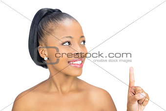 Woman looking and pointing upwards