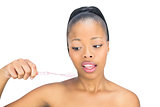 Woman looking at her toothbrush