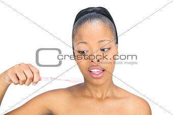 Woman looking at her toothbrush