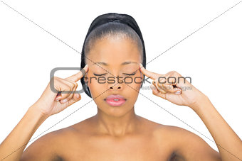 Woman with closed eyes pointing on her head