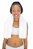 Fit woman with a towel on her shoulders