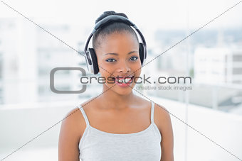 Attractive woman listening to music with headphones