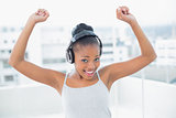 Dancing woman listening to music with headphones