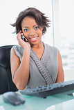 Attractive businesswoman calling on phone
