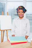 Smiling artist standing in her studio
