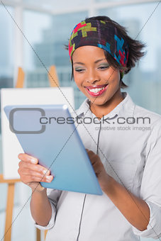Cheerful artist using tablet