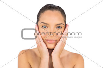 Pretty woman touching her face
