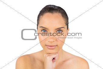 Cheerful woman holding her hand under her chin