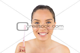 Attractive woman holding her teeth brush