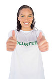 Woman wearing volunteer tshirt and giving thumb up