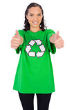 Women wearing green recycling tshirt giving thumbs up