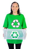 Enivromental activist holding box of recyclables