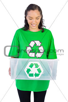 Brunette woman holding a recycling box