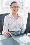 Attractive businesswoman working on her computer