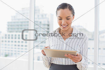 Attractive businesswoman using tablet pc